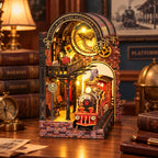 Book nook Gare du Quai Zéro allumé sur un bureau, locomotive rouge